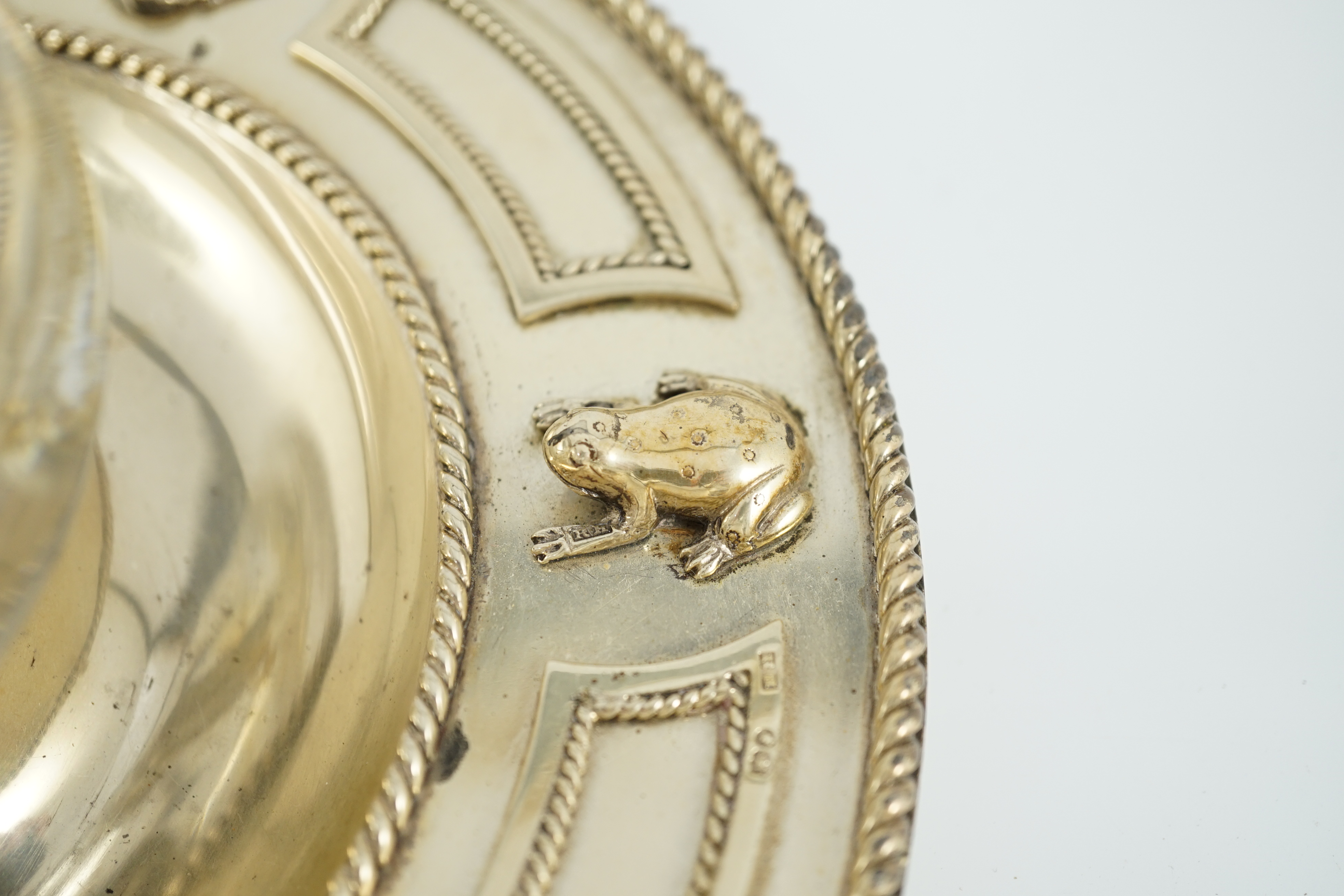 A Victorian silver gilt circular inkstand, by Robert Hennell III